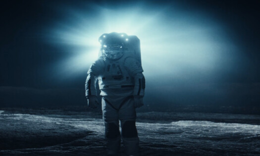 An astronaut walks on the moon