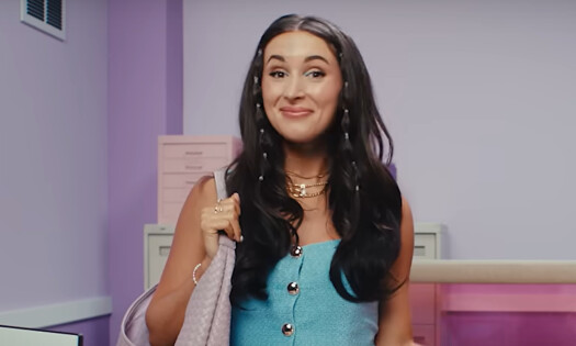 A woman smiles at the camera