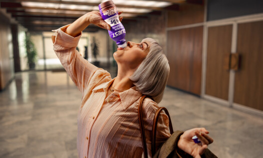 An old woman enjoying a Quest bar