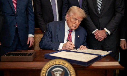 President Donald Trump signs The Genius Act
