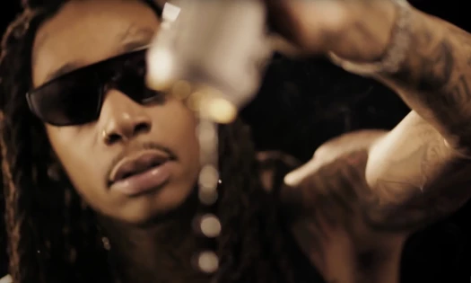 Wiz Khalifa pouring out a can of Liquid Death