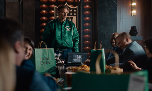 Bradley Cooper lecturing a group of people