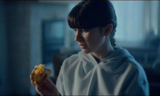 A woman looking at her burrito