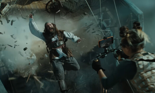 A woman shooting a movie scene with her iPhone 17 Pro