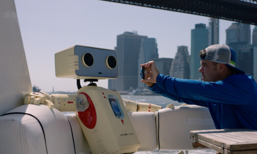 A man filming Sandisk's new robot, Memory Man