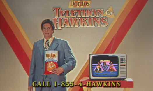 A Hawkins TV personality with a bag of Doritos