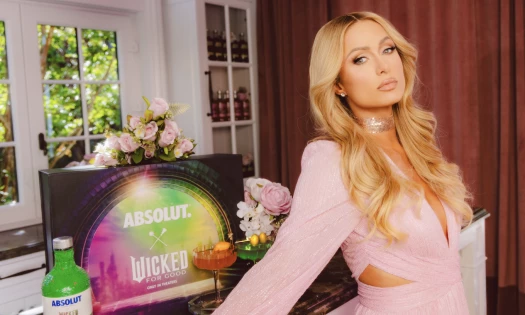 Paris Hilton with the new Absolut x Wicked bottle