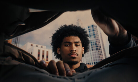 A basketball star looks into a bag