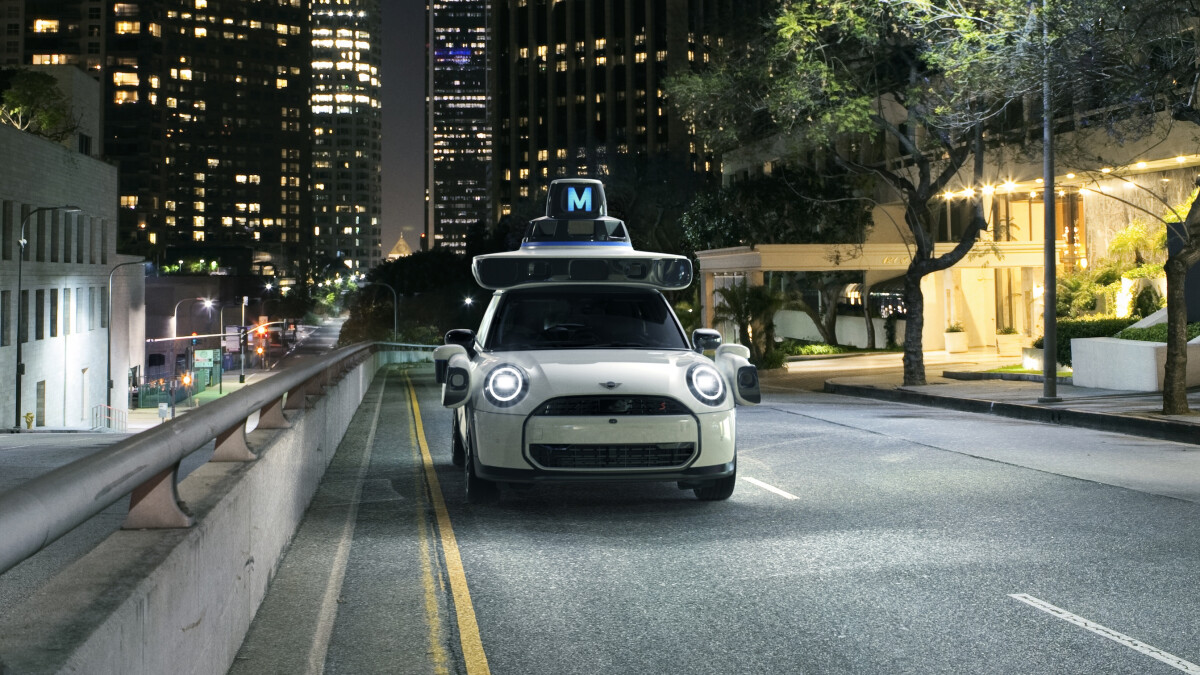 MINI USA's "ghost car" on a well-lit road at night