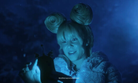 A woman looking at he rphone