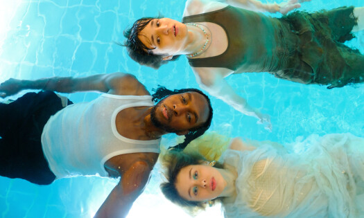 Three people on a pool