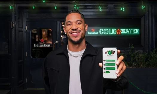 Josh Hart holding a phone up