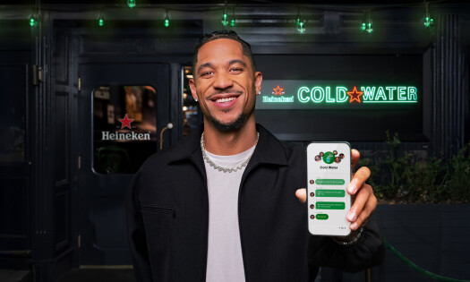 Josh Hart holding a phone up