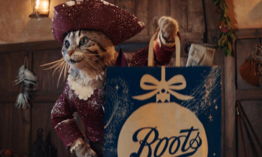 image of the puss in boots character with a Boots bag