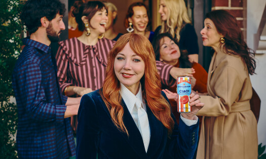 Diane Morgan holding up an S.Pellegrino