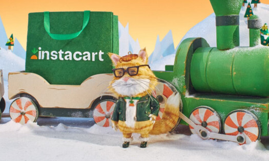 A 3D animated cat wearing Christmas-themed clothes