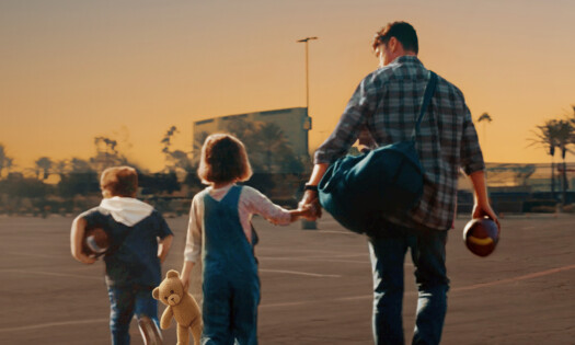 A family walks during sunset