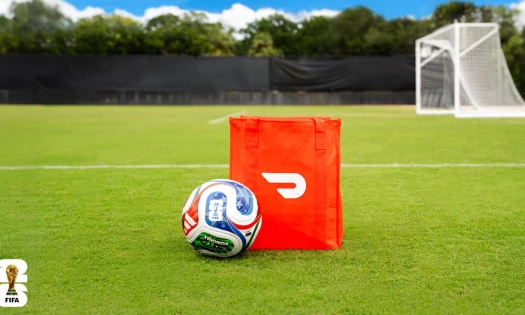 A DoorDash paper bag with the FIFA World Cup ball