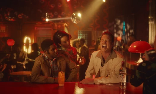A man laughing at the pub