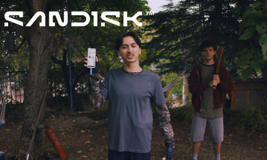 A man holding his phone up angrily