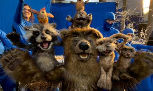 Animated critters smile at the camera