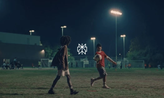 Two kids on a football field