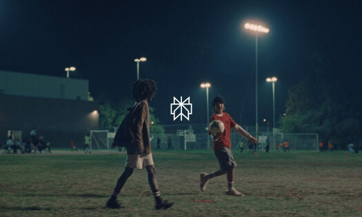 Two kids on a football field