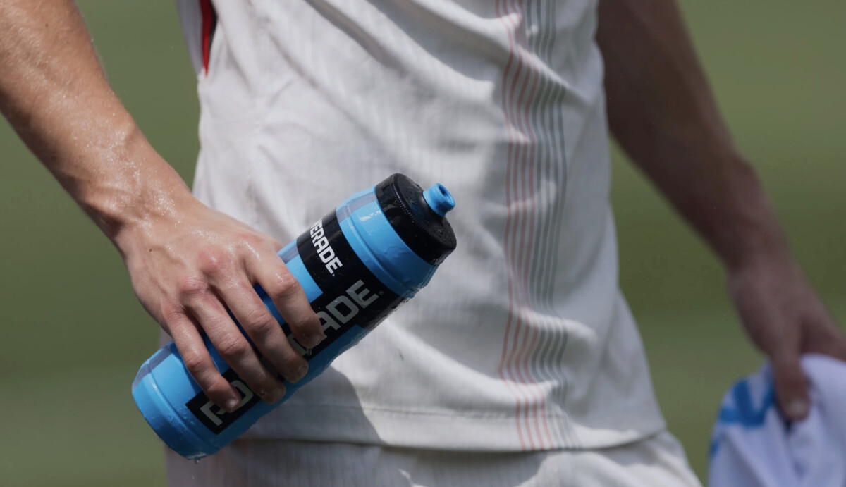 A screenshot of a FIFA World Cup player drinking water while on the field