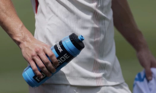 A screenshot of a FIFA World Cup player drinking water while on the field