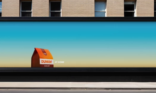 A Dunkin' At Home OOH billboard
