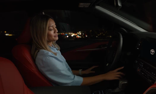 A woman in a new Toyota vehicle