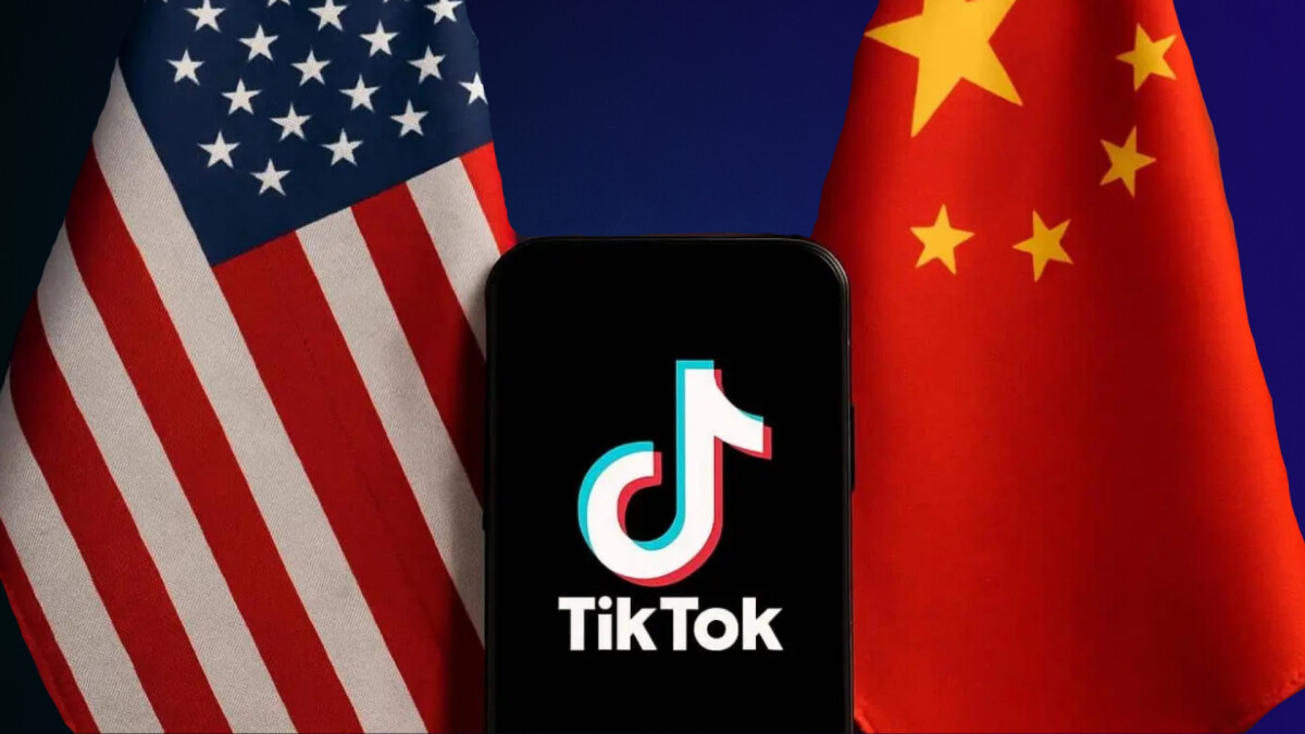 Chinese and American flag with mobile device depicting TikTok logo