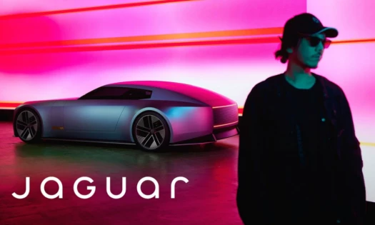 jaguar car in the background with a person in front