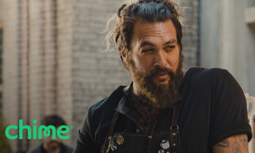 Jason Momoa wearing a barista's uniform