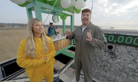 Mr.Beast and a girl in front of a Starbucks stand