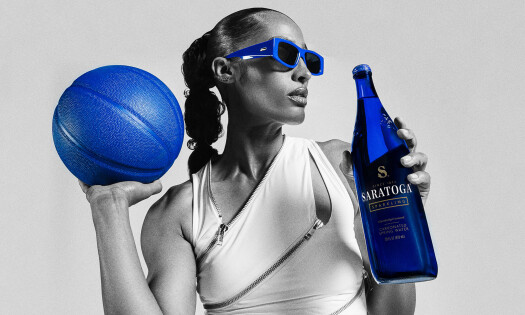 Skylar Diggins holding a basketball and a bottle of Saratoga
