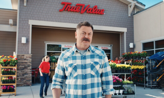 nick offerman talking in front of tru value building