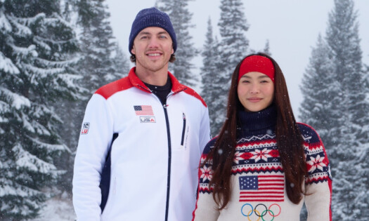 Two Team USA athletes smile at the camera
