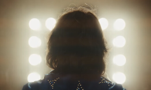 A mystery man faces away from the camera