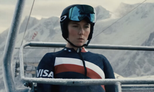 Mikaela Shiffrin on board a snow lift wearing VISA logo