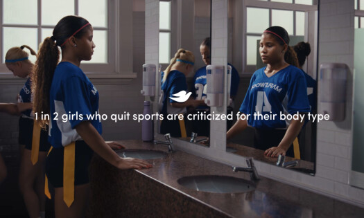 A girl looking at herself in the mirror with the text: 1 in 2 girls who quit sports are criticized for their body type