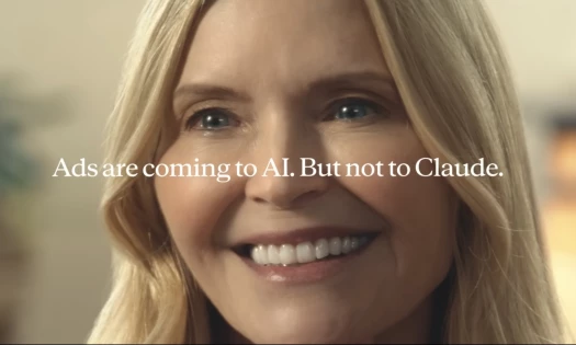 A close-up shot of a blonde-haired woman smiling with the text "Ads are coming to AI. But not to Claude." across the middle of the frame