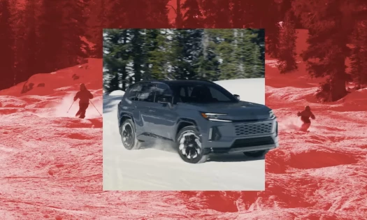 The 2026 Toyota RAV4 on the ski slopes with skiers in the background