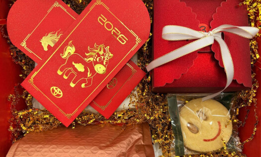 A Prosperity Box offered by Toyota Norcal for Chinese New Year, showing candy and cards featuring Year of the Horse graphics