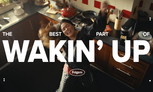 The best part of wakin' up with Folgers text with a woman dancing in the kitchen
