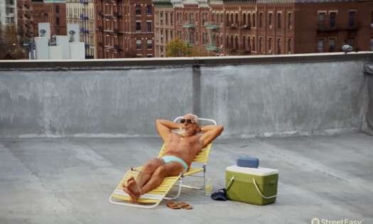 A man resting on a rooftop