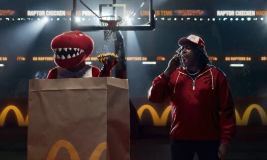 Toronto Raptors mascot inside a McDonald's paper bag