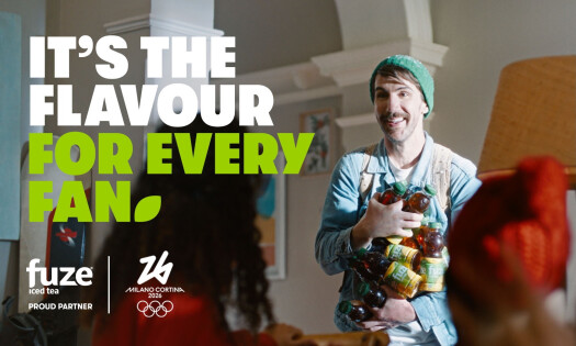 A man holding bottles of Fuze Iced Tea with the text "It's the Flavour for Every Fan" on the side