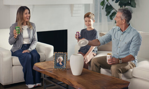 A screenshot of the Eternal Playlist Urn, with hand lifting its lid modeled after a speaker