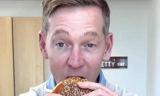 The McDonald's CEO trying the new Big Arches burger